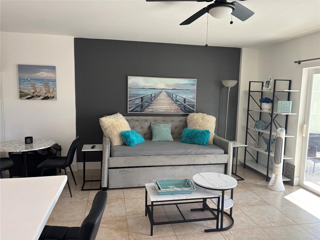 2900 Northeast 30th Street, Unit B2 Fort Lauderdale, FL 33306 - Photo 10 of 31 a living room with furniture and a lamp