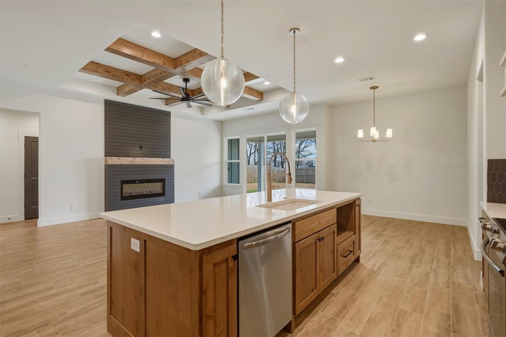 421 Red Bud Lane Tolar, TX 76476 - Photo 14 of 40 a kitchen with a table and chairs in it