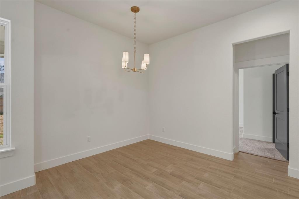 421 Red Bud Lane Tolar, TX 76476 - Photo 17 of 40 a view of empty room with wooden floor