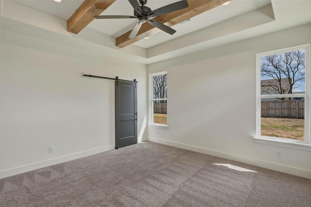 421 Red Bud Lane Tolar, TX 76476 - Photo 20 of 40 an empty room with windows and fan