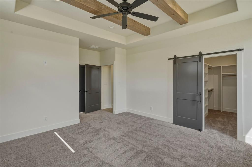 421 Red Bud Lane Tolar, TX 76476 - Photo 21 of 40 an empty room with closet and a ceiling fan