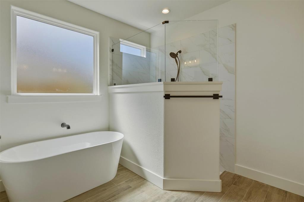 421 Red Bud Lane Tolar, TX 76476 - Photo 23 of 40 a bathroom with a bathtub and a sink