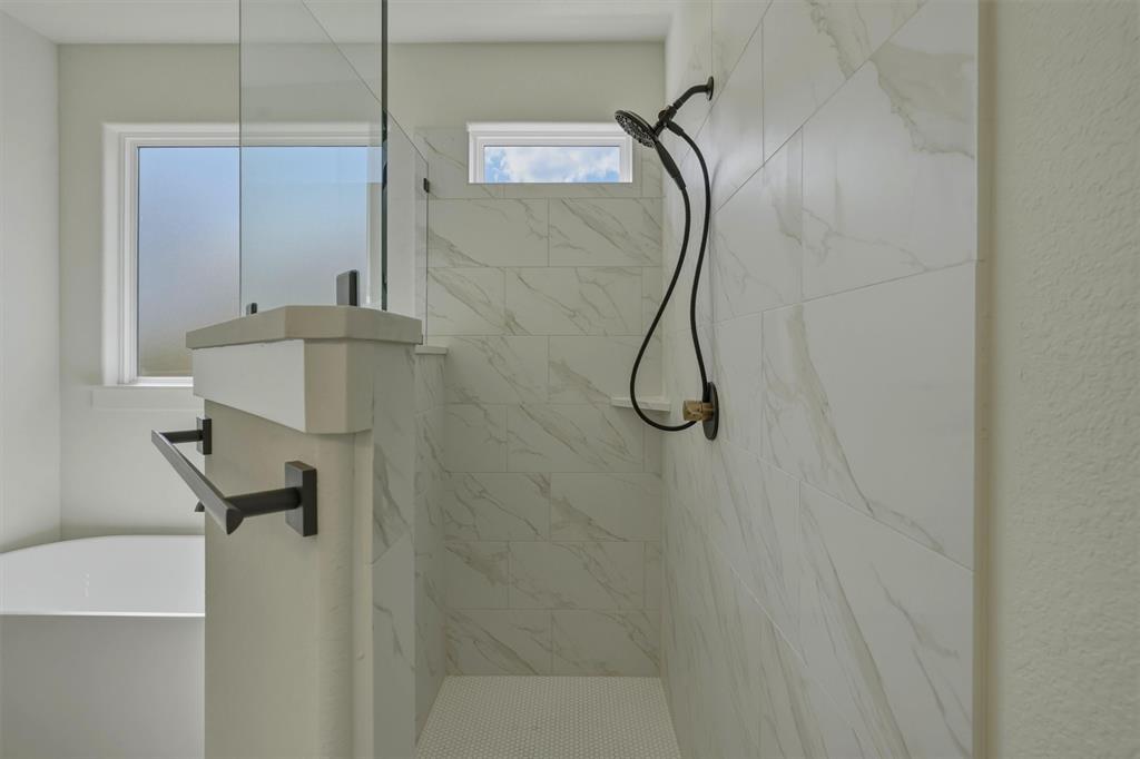 421 Red Bud Lane Tolar, TX 76476 - Photo 25 of 40 a bathroom with a shower