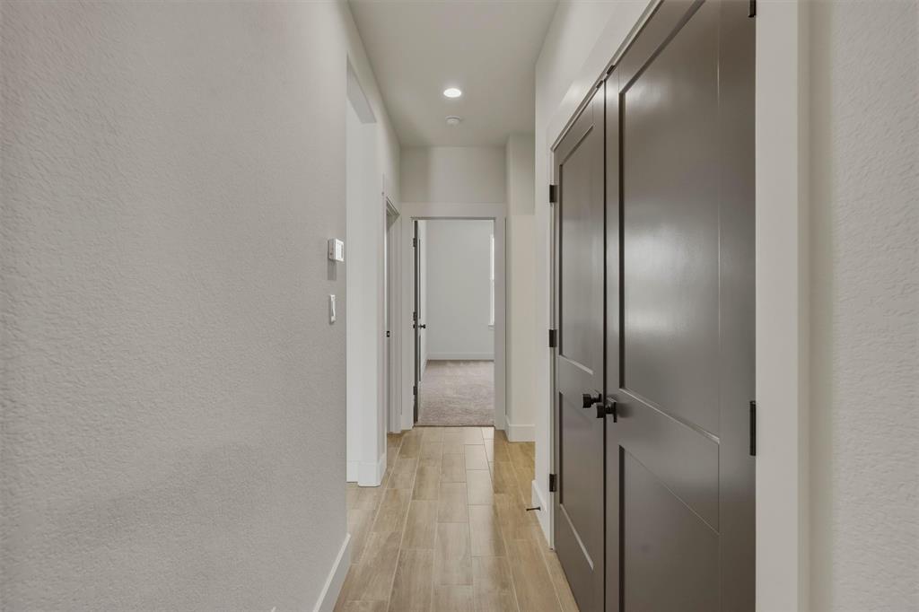 421 Red Bud Lane Tolar, TX 76476 - Photo 27 of 40 a bathroom with a glass shower door