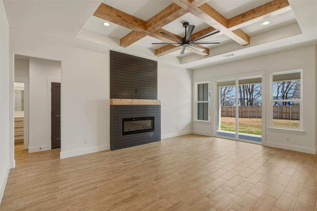 421 Red Bud Lane Tolar, TX 76476 - Photo 6 of 40 a view of empty room with wooden floor and fan
