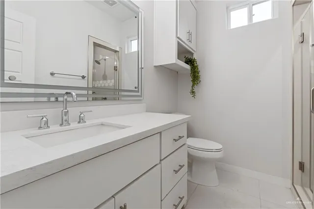 an empty room with chandelier fan