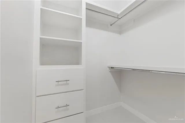 a view of a hallway with closet