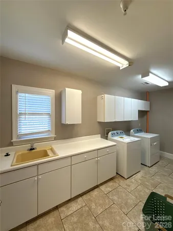 a bedroom with a bed and a tv