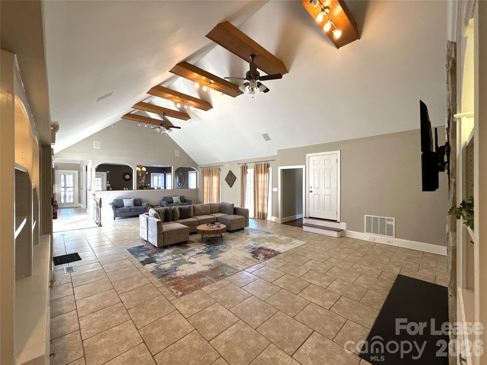 14009 Thompson Road Charlotte, NC 28227 - Photo 2 of 42 a living room with furniture and a flat screen tv