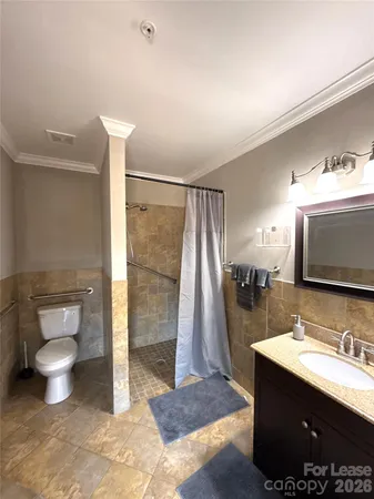a bathroom with a shower and a shower