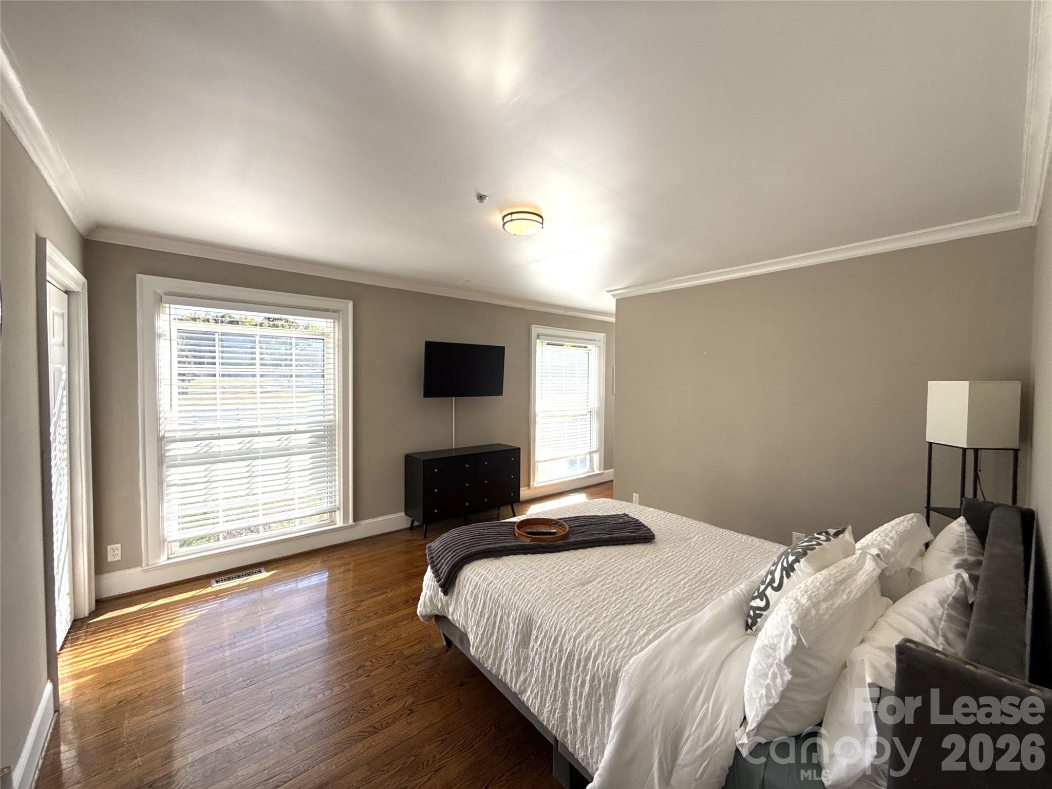 14009 Thompson Road Charlotte, NC 28227 - Photo 24 of 42 a bedroom with a bed and a tv