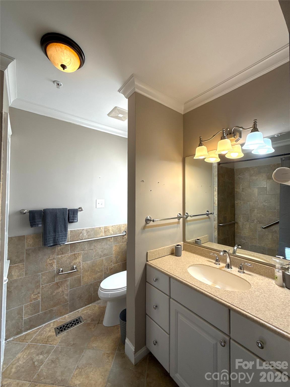 14009 Thompson Road Charlotte, NC 28227 - Photo 28 of 42 a bathroom with a double vanity sink toilet and a mirror