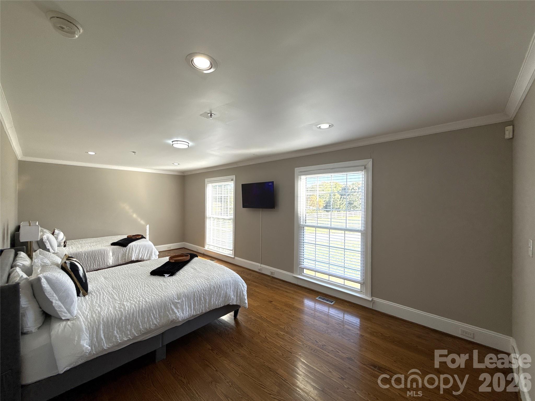 14009 Thompson Road Charlotte, NC 28227 - Photo 30 of 42 a bedroom with a large bed and a large window