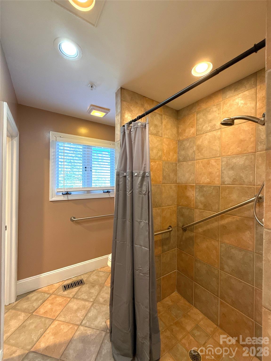 14009 Thompson Road Charlotte, NC 28227 - Photo 32 of 42 a bathroom with a shower and a shower