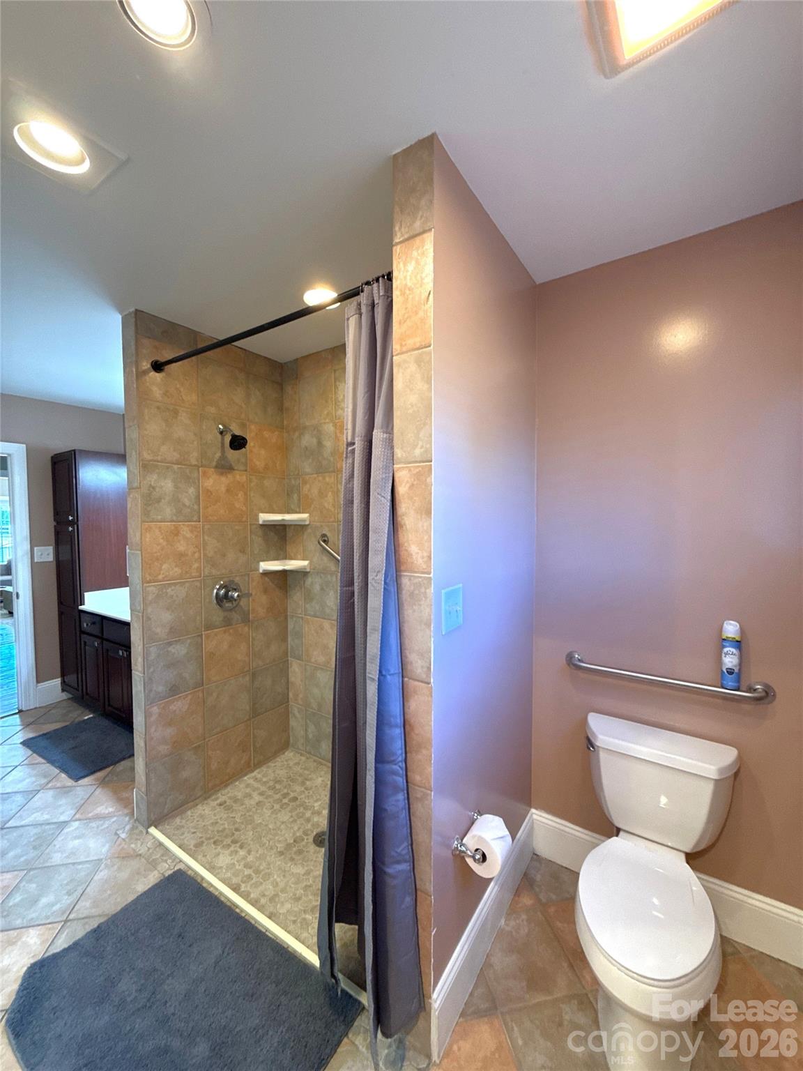 14009 Thompson Road Charlotte, NC 28227 - Photo 34 of 42 a bathroom with a toilet shower vanity and a sink
