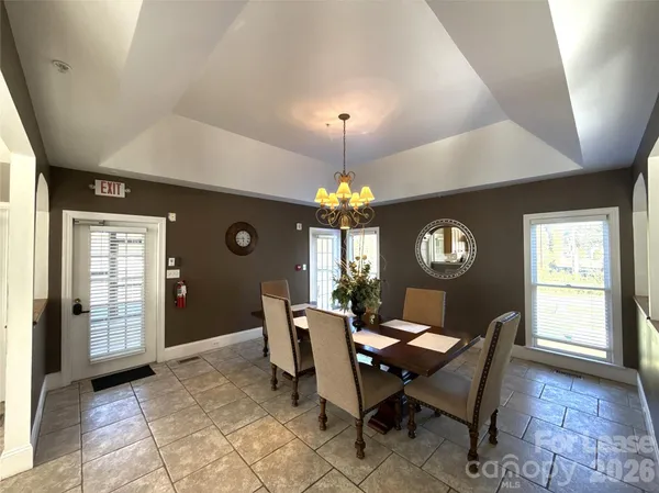 a kitchen with stainless steel appliances granite countertop a stove a sink dishwasher and a refrigerator