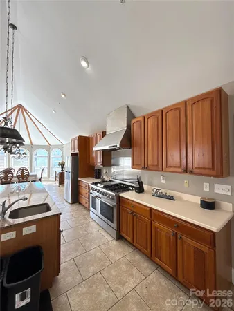 a view of a dining room with furniture and a window