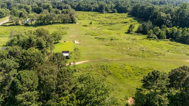 a view of a lake with a yard