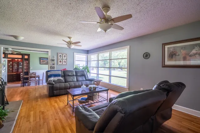 a living room with furniture and a window