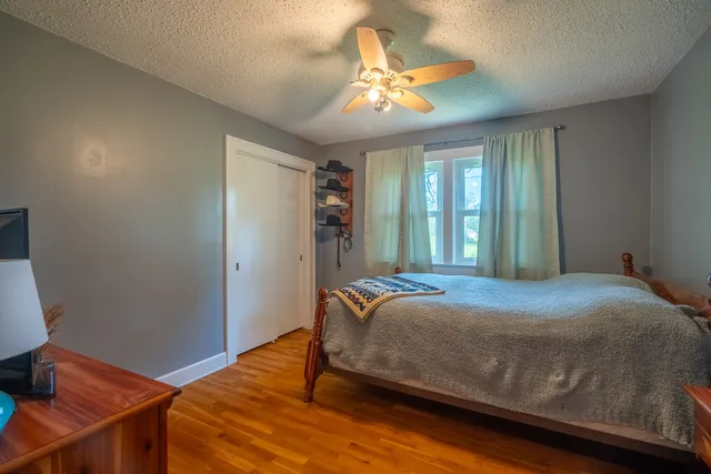 a bedroom with a bed and window