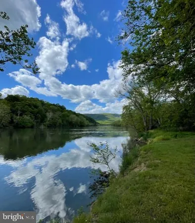 a view of lake with green space