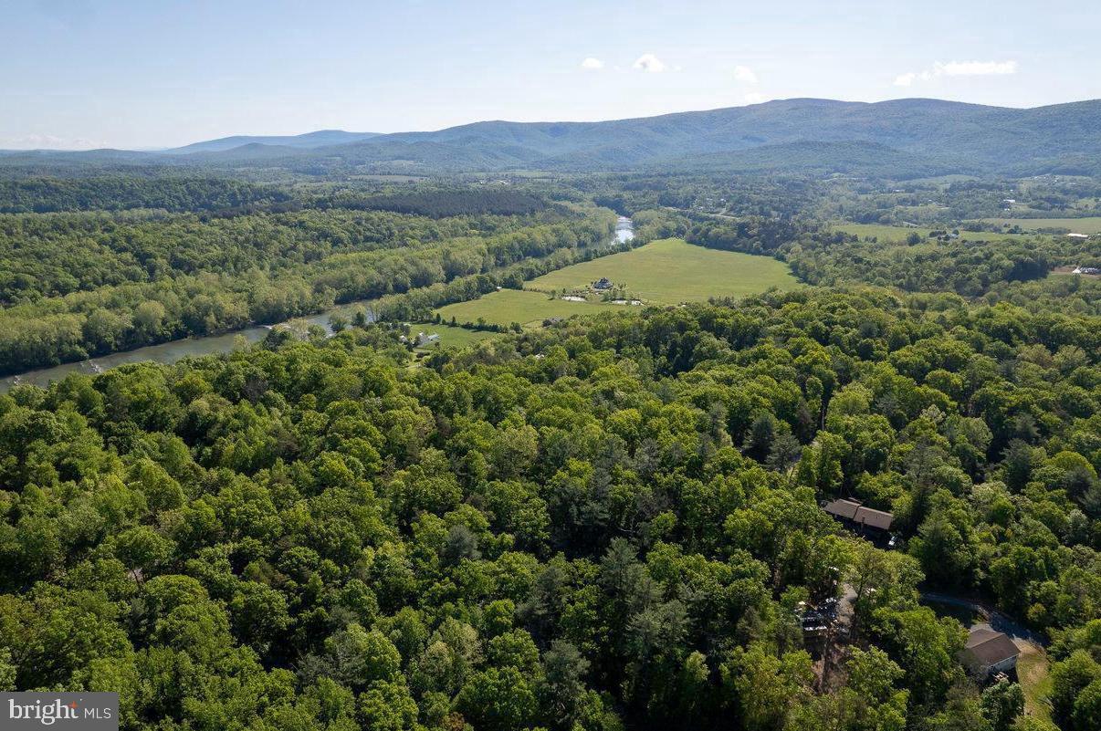 C34 Woodside Drive Rileyville, VA 22650 - Photo 5 of 6 a view of a lush green hillside and a building