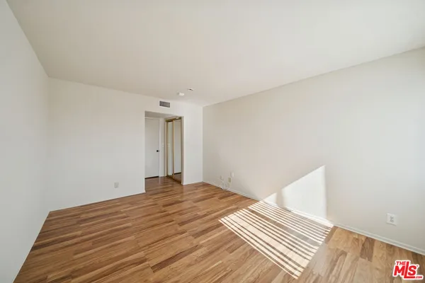 a view of front door with wooden floor