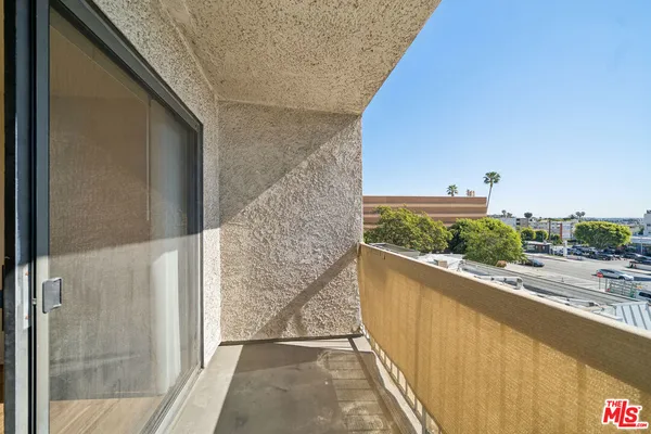 a bathroom with a sink a toilet a mirror and shower