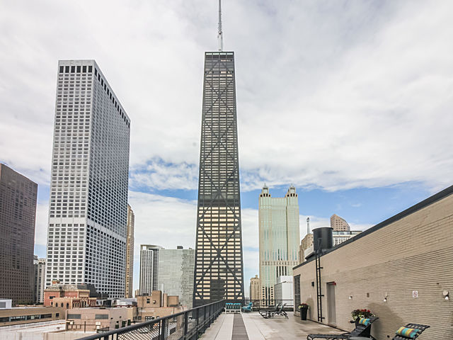 253 East Delaware Place, Unit 5E Chicago, IL 60611 - Photo 13 of 17 a city view with tall buildings