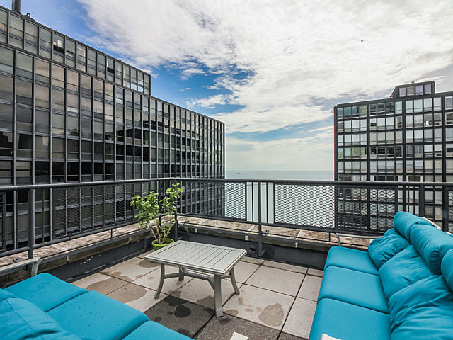 253 East Delaware Place, Unit 5E Chicago, IL 60611 - Photo 14 of 17 a roof deck with couch