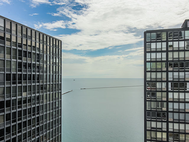 253 East Delaware Place, Unit 5E Chicago, IL 60611 - Photo 15 of 17 a view of a building with a black door
