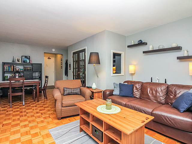 253 East Delaware Place, Unit 5E Chicago, IL 60611 - Photo 2 of 17 a living room with furniture a rug and a table
