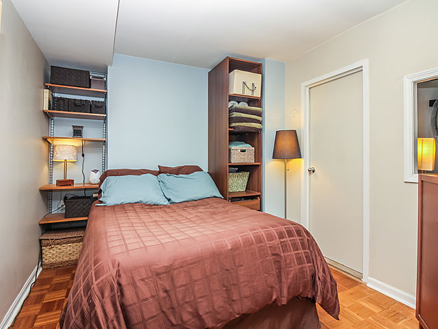 253 East Delaware Place, Unit 5E Chicago, IL 60611 - Photo 6 of 17 a bedroom with a bed and a closet