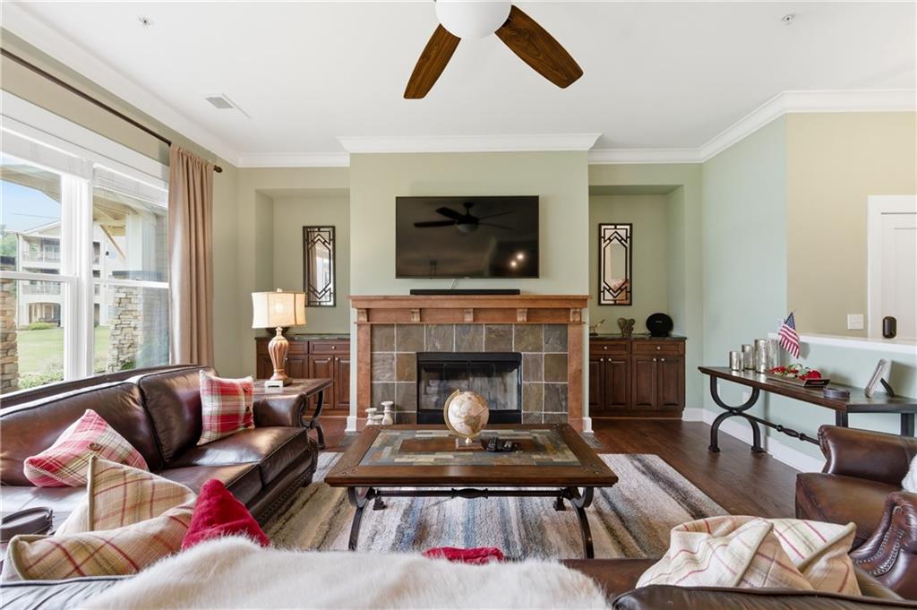 117 South Bay Road, Unit 402 Eatonton, GA 31024 - Photo 25 of 48 a living room with furniture and a fireplace
