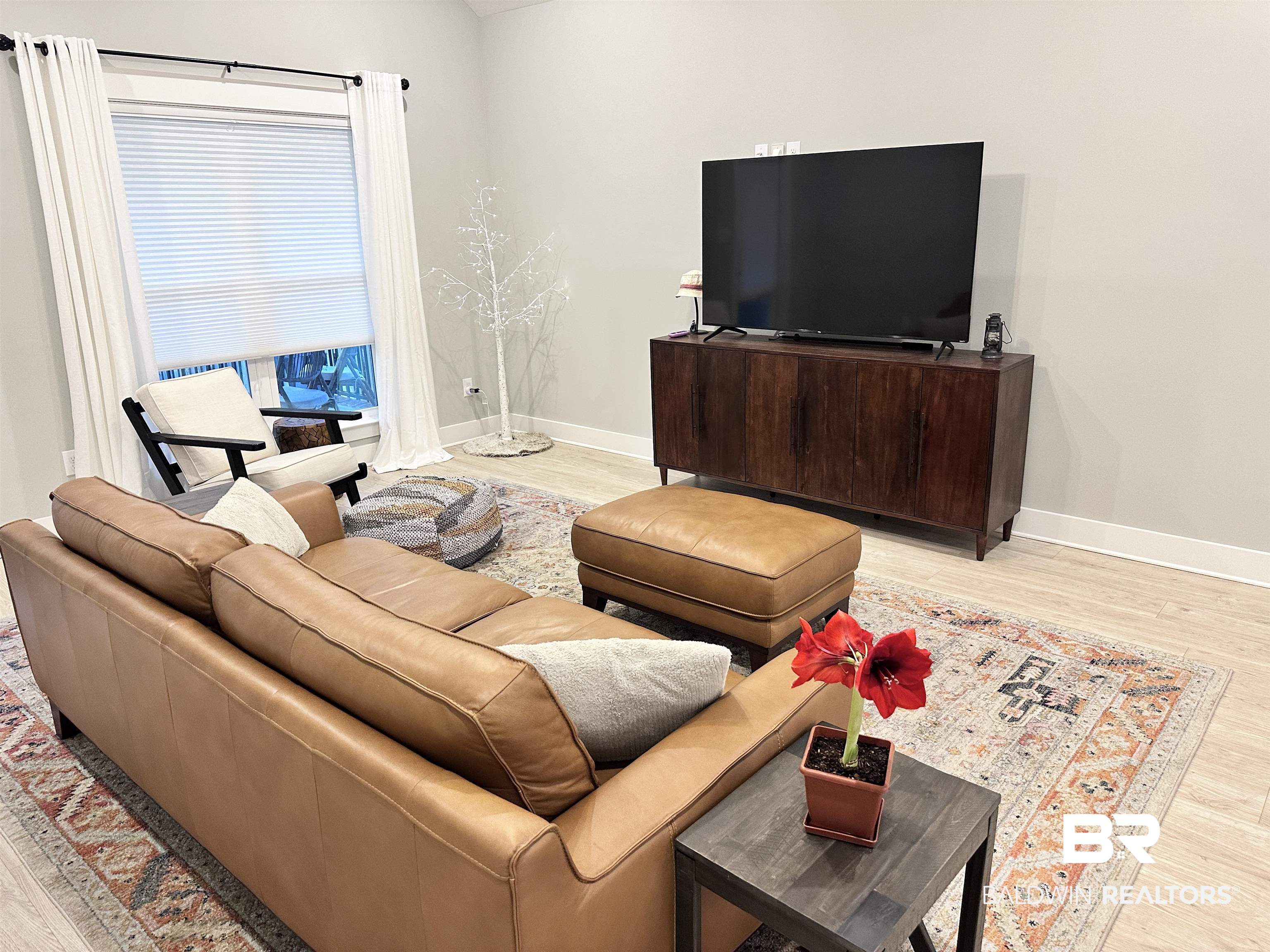 655 H Norman Lane Fairhope, AL 36532 - Photo 11 of 30 Living room featuring light wood-type flooring