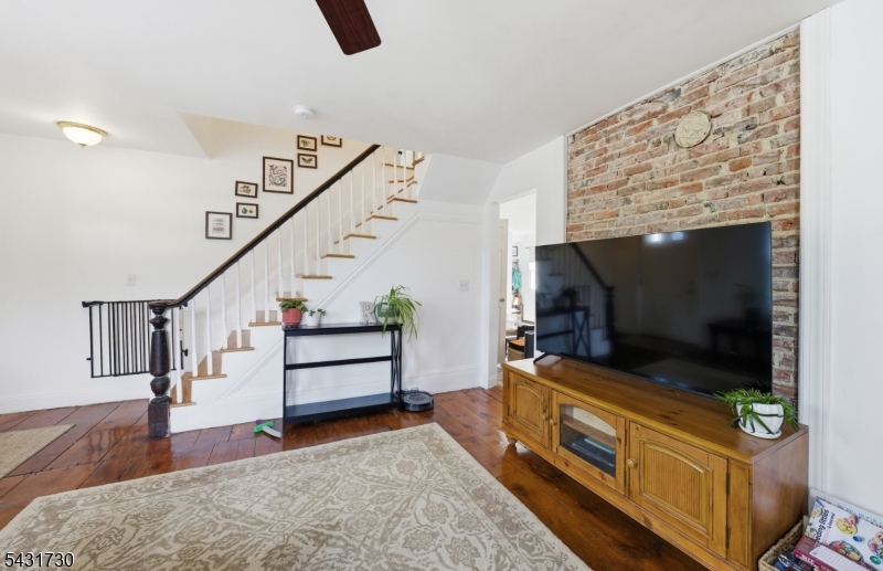 105 Main Street Lebanon, NJ 08833 - Photo 2 of 25 a living room with furniture and a flat screen tv
