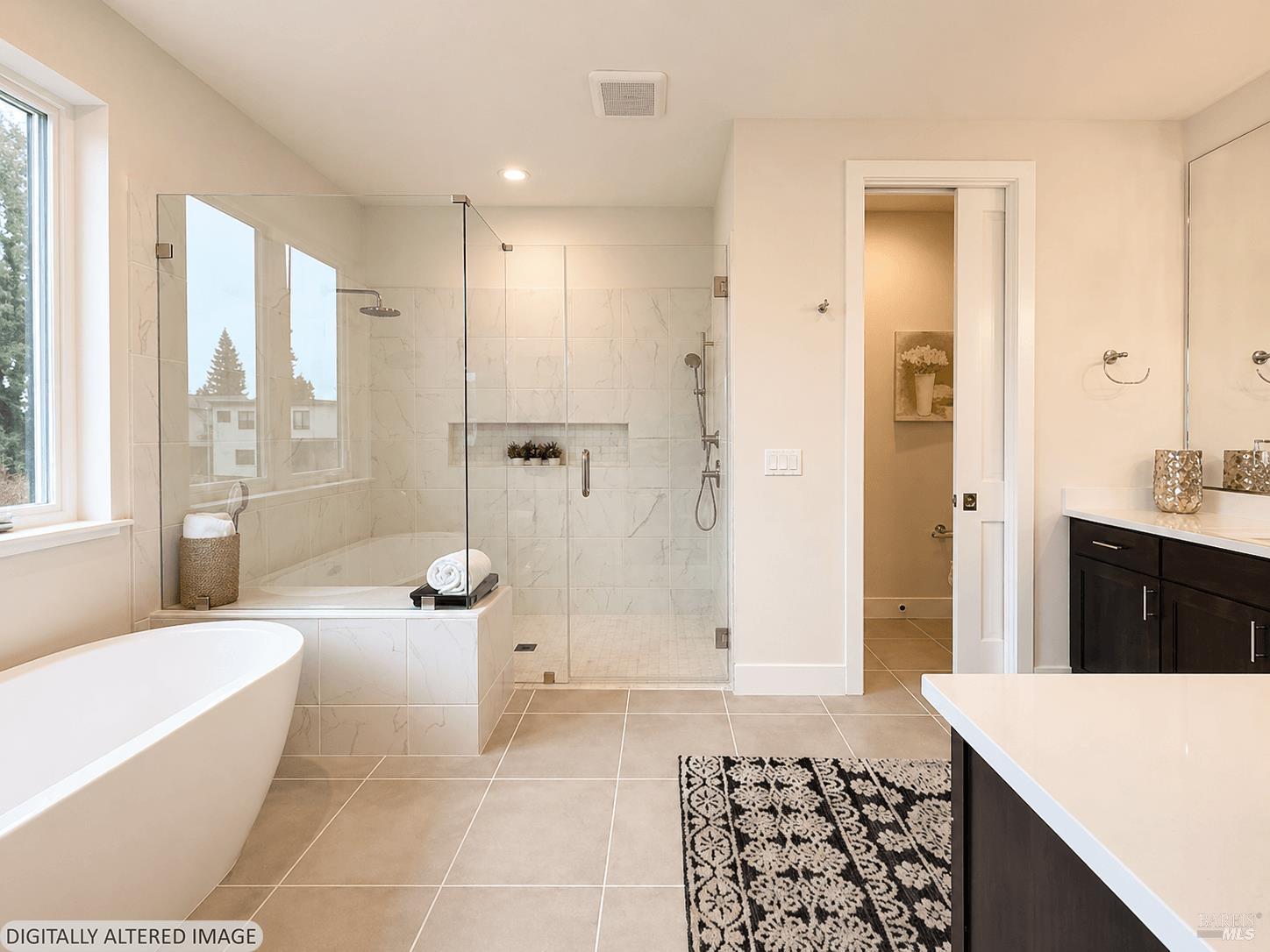 1901 Carlile Place Santa Rosa, CA 95403 - Photo 22 of 29 Here we arrive at the upper-level primary bathroom suite. Huge curb less shower with glass doors, separate soaking tub and beautiful tile flooring!