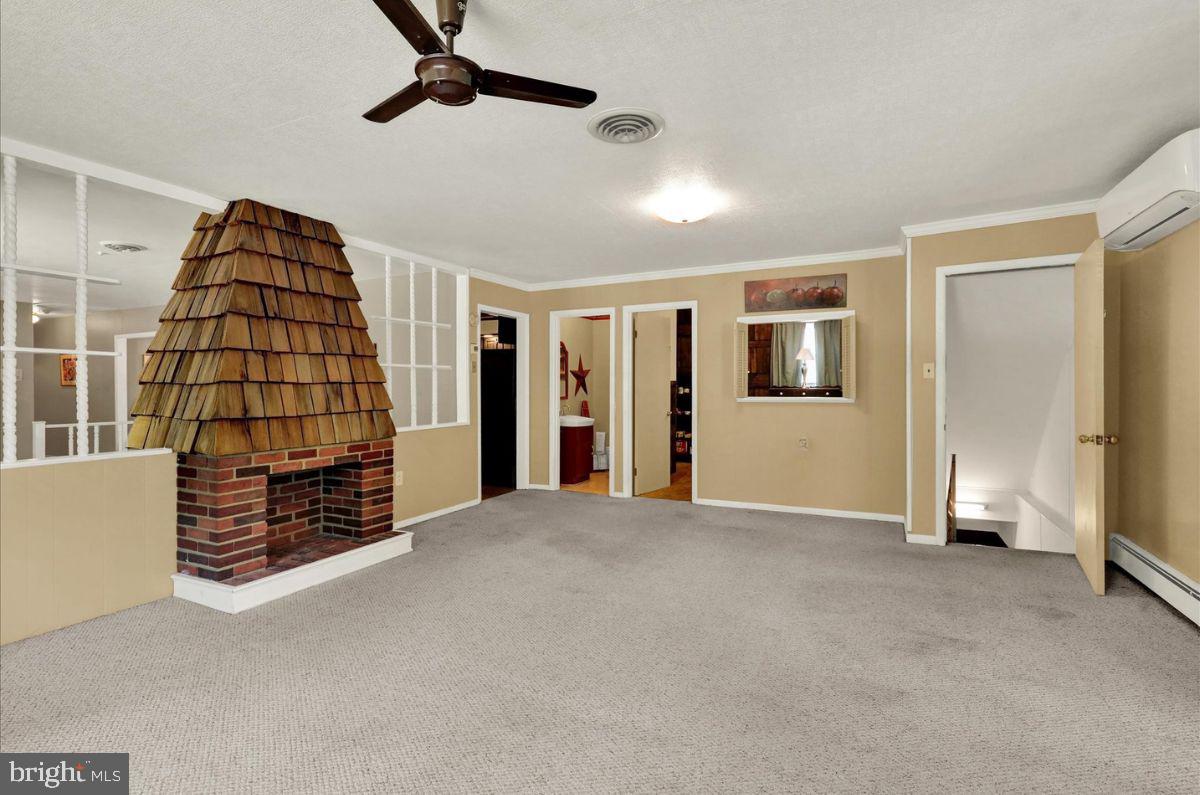833 Joan Terrace Reading, PA 19611 - Photo 25 of 51 Den with decorative fireplace