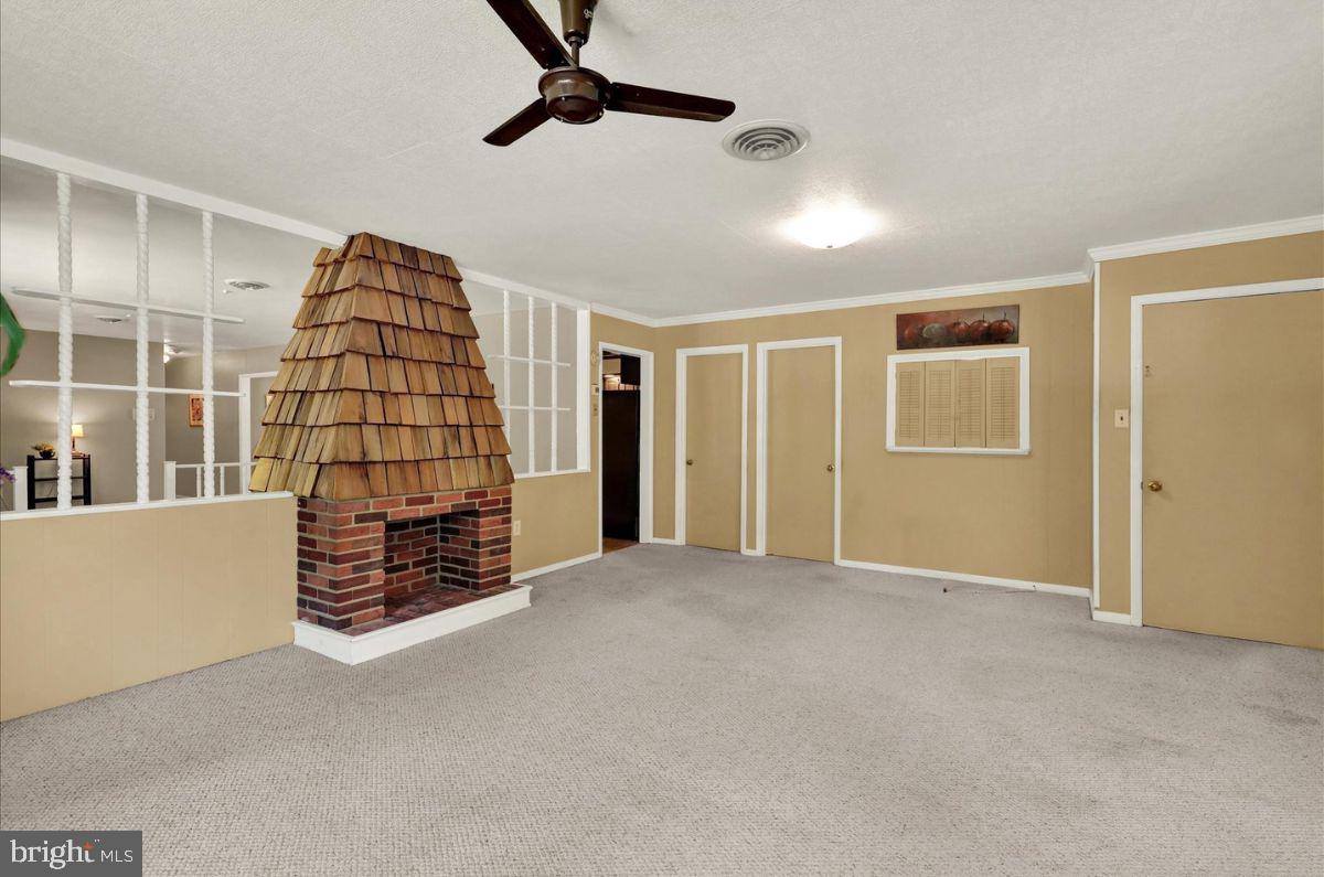 833 Joan Terrace Reading, PA 19611 - Photo 26 of 51 Den with decorative fireplace