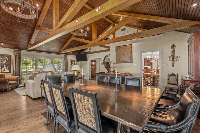 a living room with lots of furniture and gym equipment