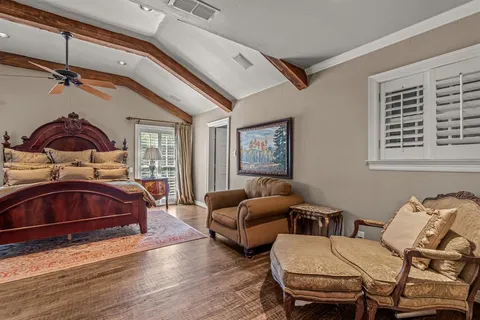 a bedroom with furniture and a window
