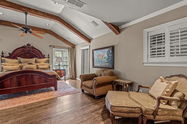 a bedroom with furniture and a window