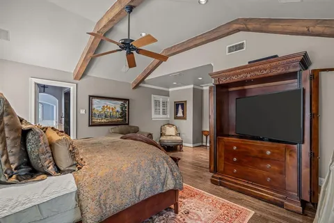 a bedroom with a bed and dresser