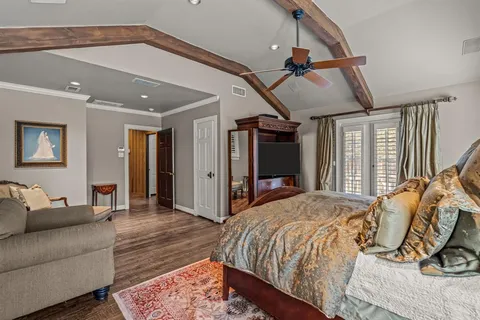 a bed room with a bed and a mirror