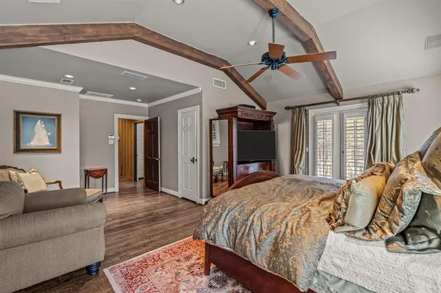 a bed room with a bed and a mirror