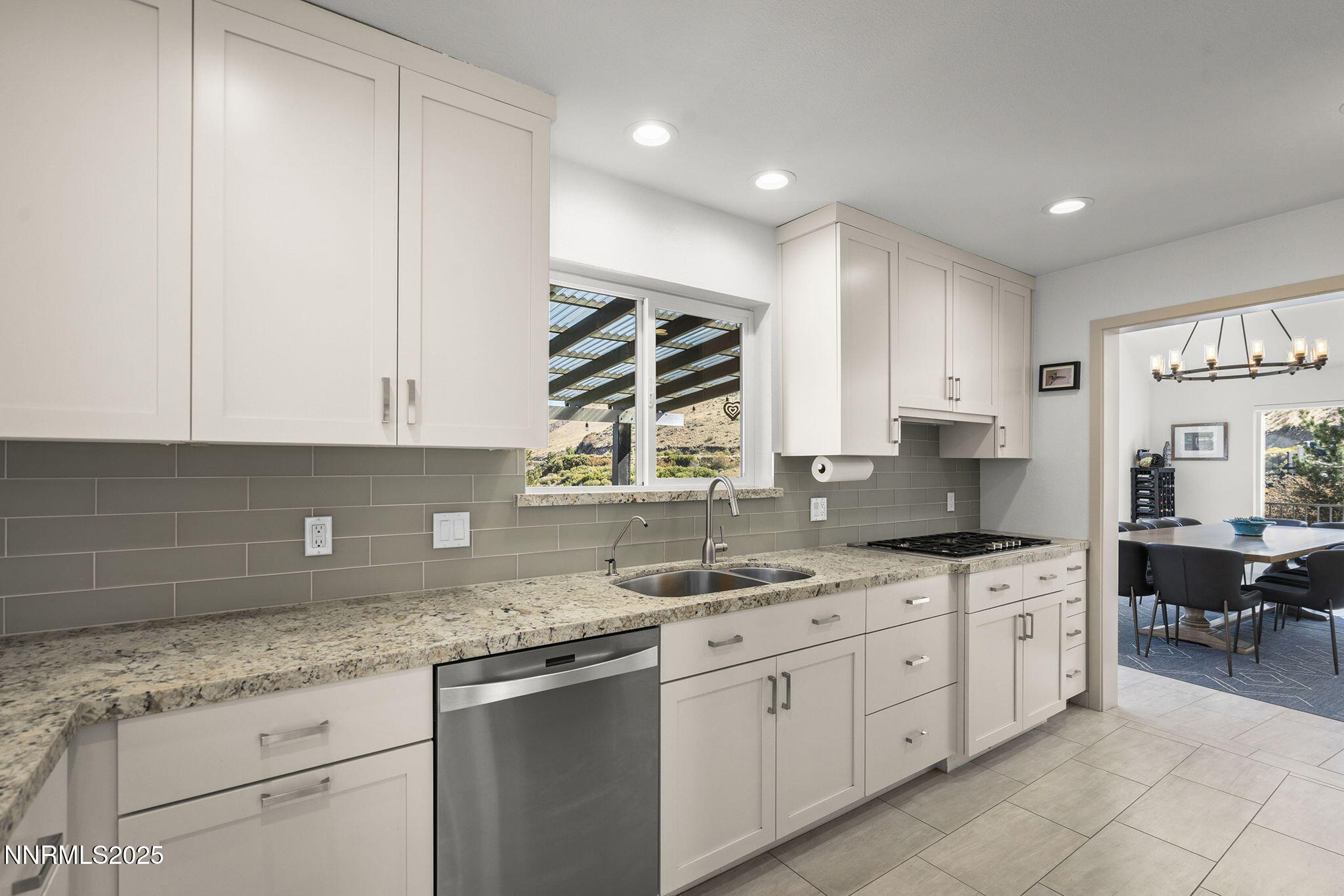 2885 Erminia Road Reno, NV 89523 - Photo 13 of 38 a kitchen with a sink stove and cabinets