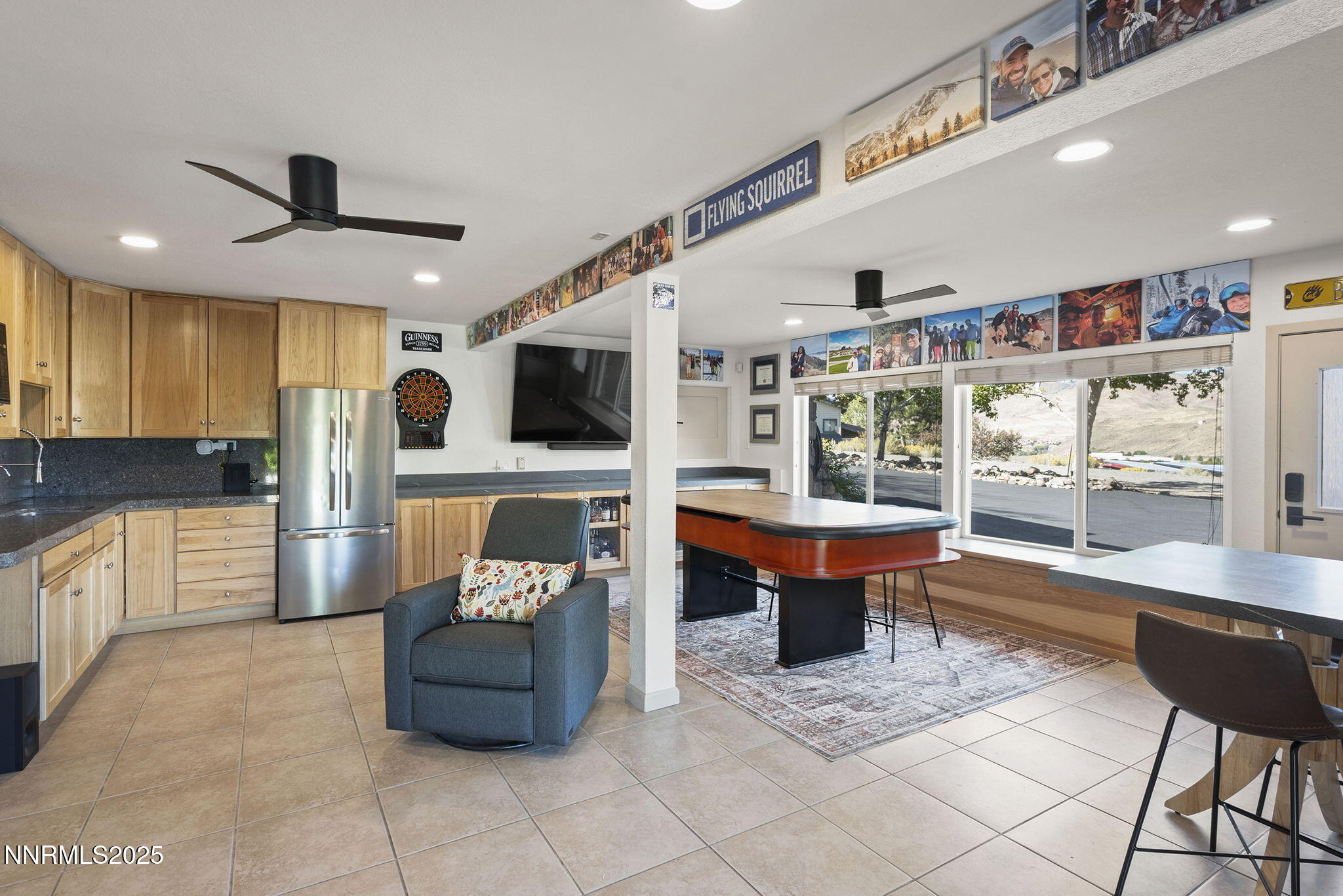 2885 Erminia Road Reno, NV 89523 - Photo 21 of 38 a kitchen with stainless steel appliances kitchen island granite countertop a sink and cabinets