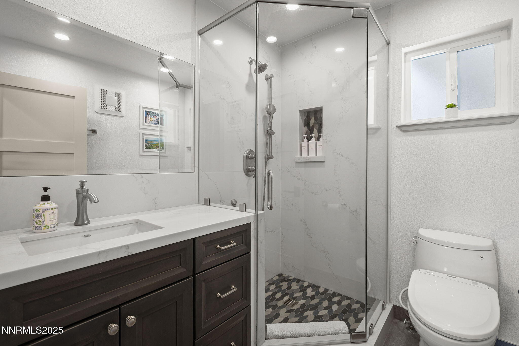 2885 Erminia Road Reno, NV 89523 - Photo 28 of 38 a bathroom with a sink a toilet and shower