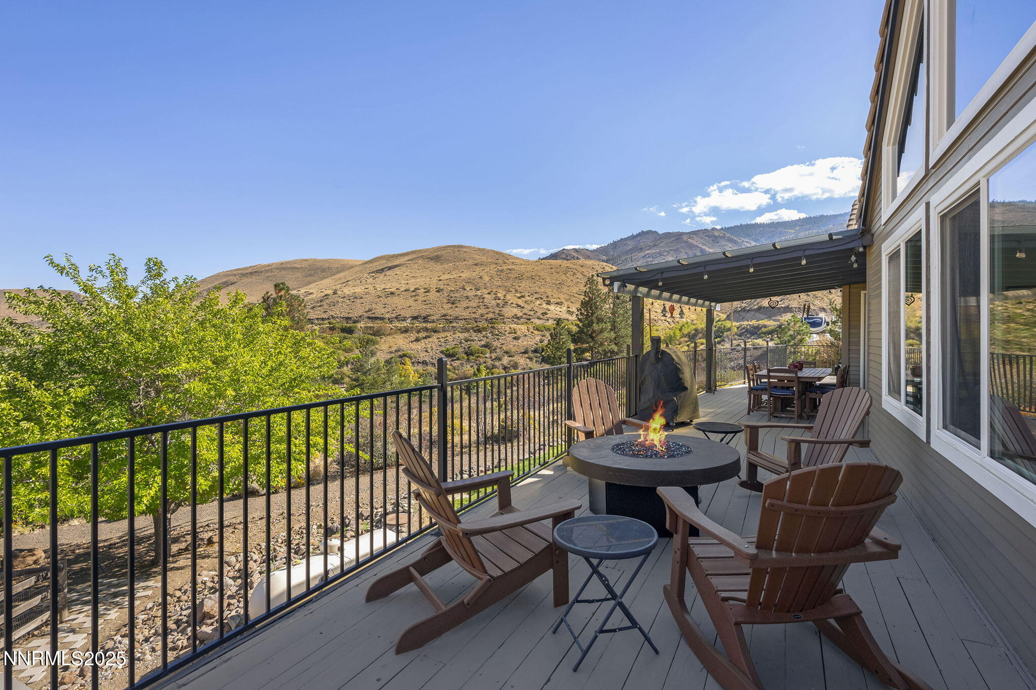 2885 Erminia Road Reno, NV 89523 - Photo 33 of 38 a view of a chairs and table in patio with a yard