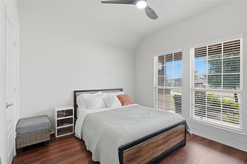 10101 Travis Road Little Elm, TX 75068 - Photo 6 of 26 a bedroom with a bed and a window